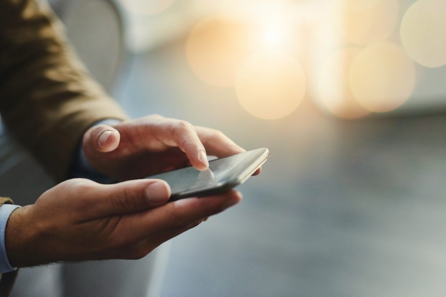 hands holding smartphone