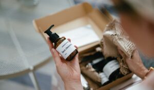 Close up of hand holding product out of box.